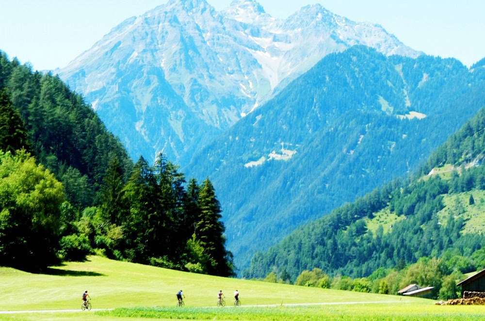 Cyclists against a dramatic mountainscape