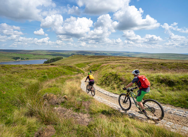 Mountain bikers on a rocky trail along the Pennine Bridleway